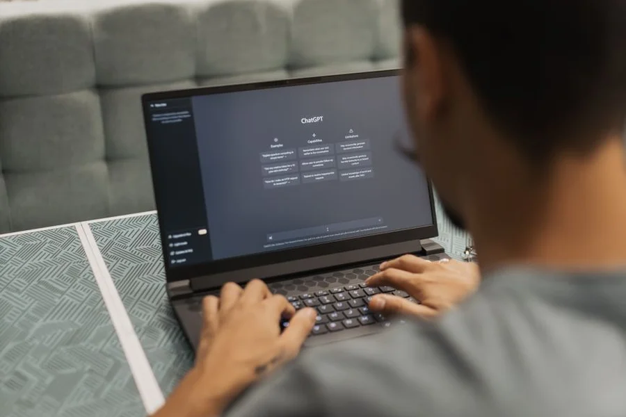 Computer user checking software update settings on a laptop screen